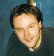 Angi, Michel (1970-)